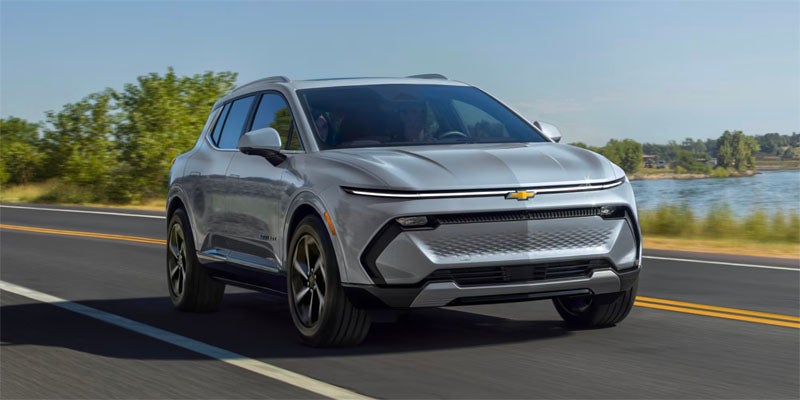 Gray Chevy Equinox EV running on road