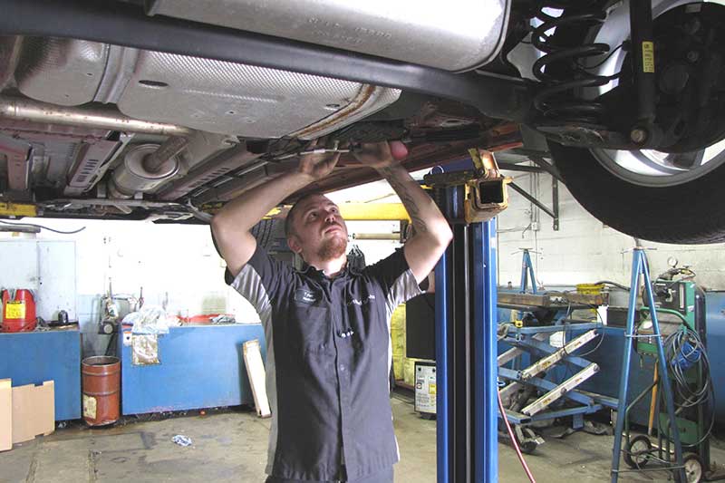 A service technicians at Heritage Chevrolet -MI smiling